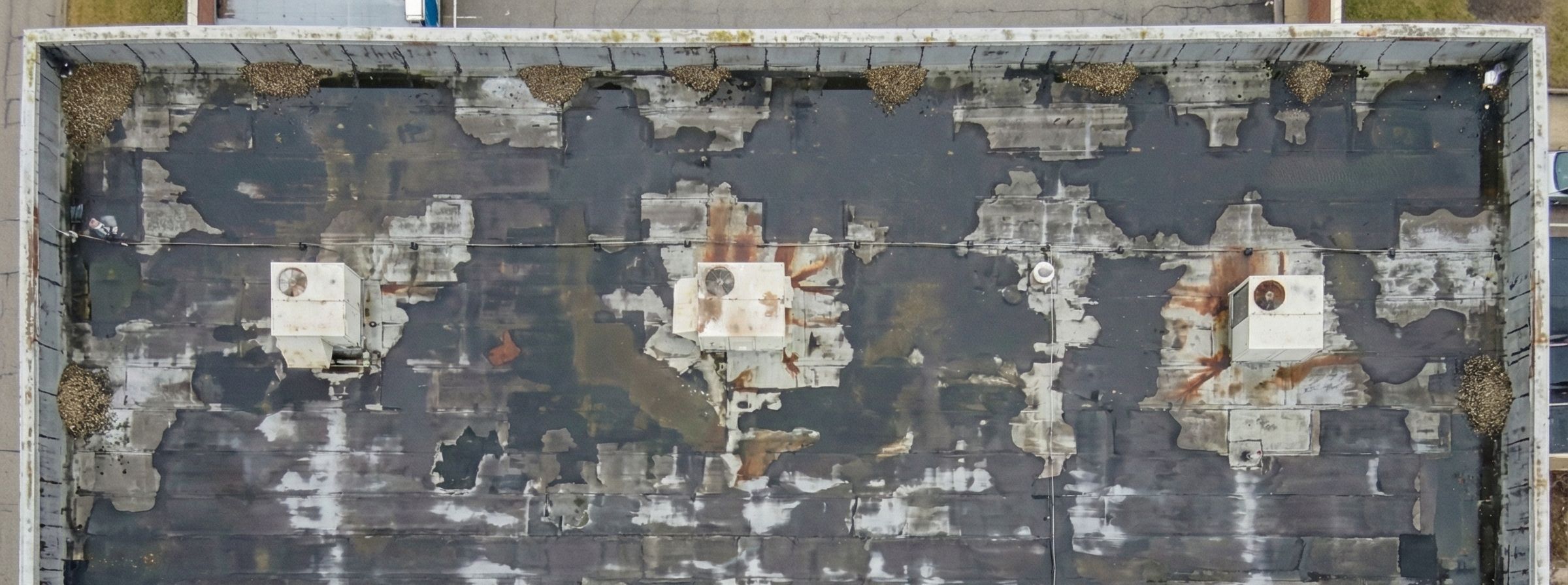 Aging commercial roof before restoration